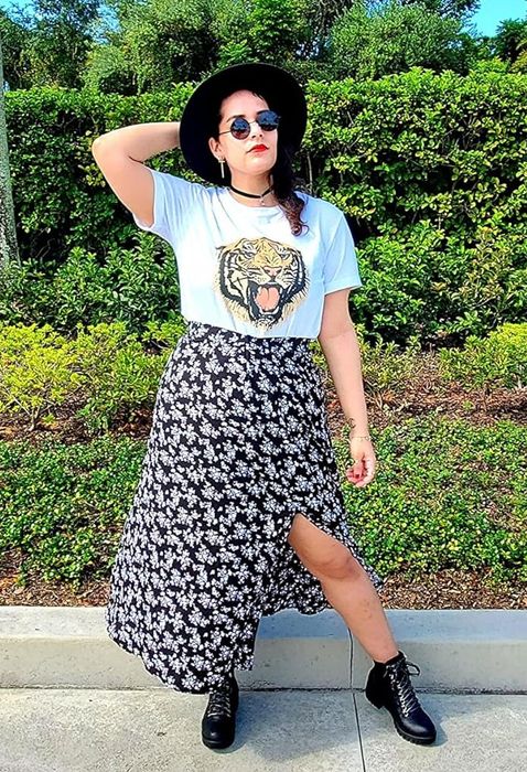 A reviewer modeling the elegant black floral skirt