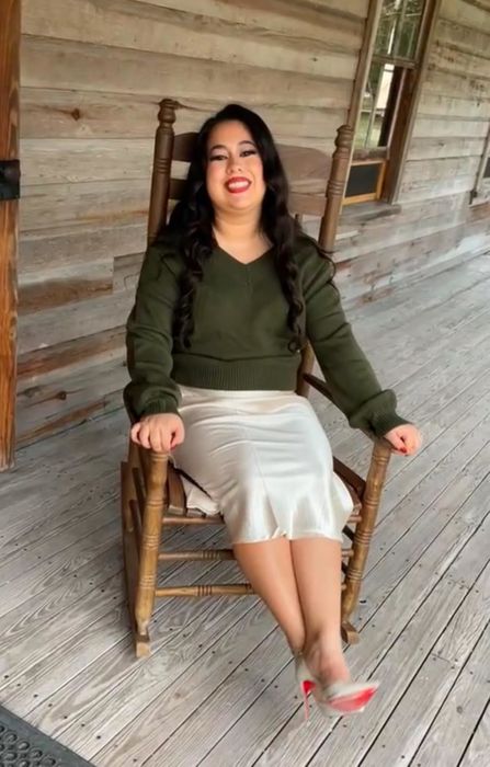 A reviewer showcasing the pastel peach skirt