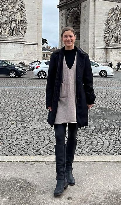 A reviewer showcasing the khaki dress