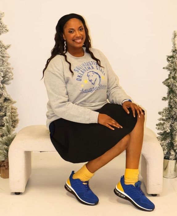 A reviewer wearing the black skirt