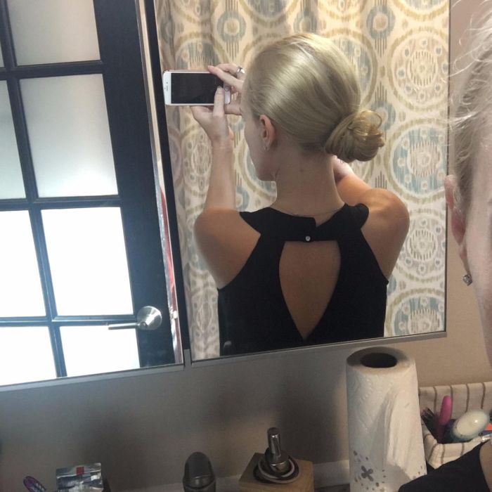 Reviewer displaying a neat bun after applying the spin pins