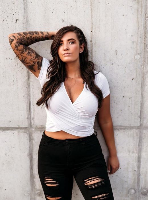 A reviewer showcasing the white top