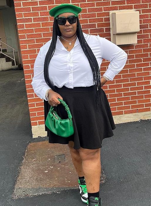 A reviewer showcasing the black skirt