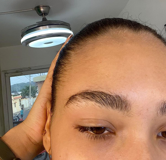 Reviewer's perfectly groomed brows after applying the clear gel