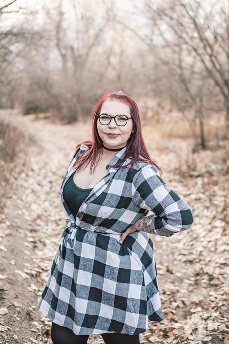 Reviewer wearing the dress in a classic black and white combination.