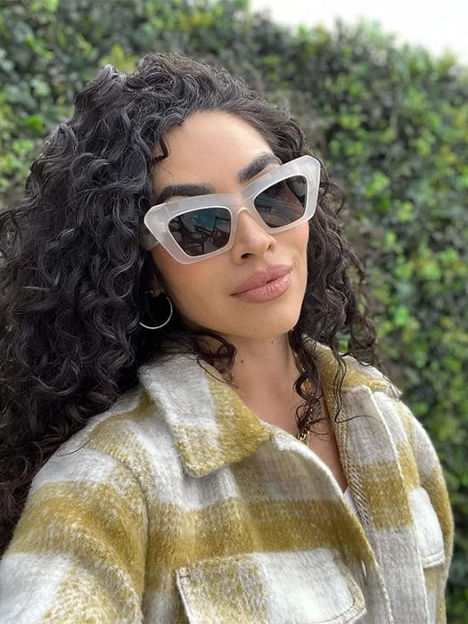 model showcasing the sunglasses with transparent frames