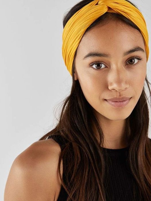 Model wearing a yellow knotted headband