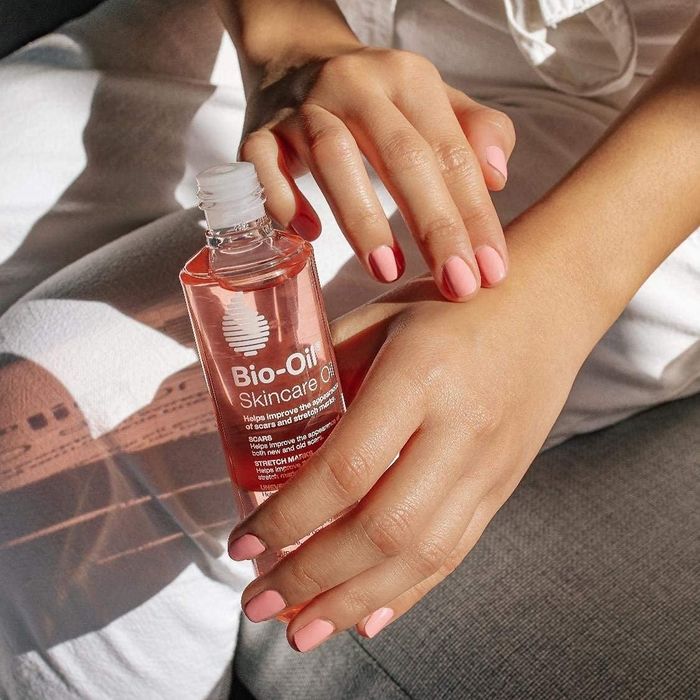 Model applying Bio-Oil to their skin