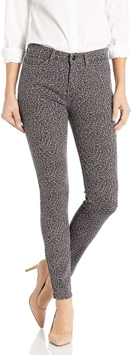 A model rocking cheetah print jeans paired with high heels.