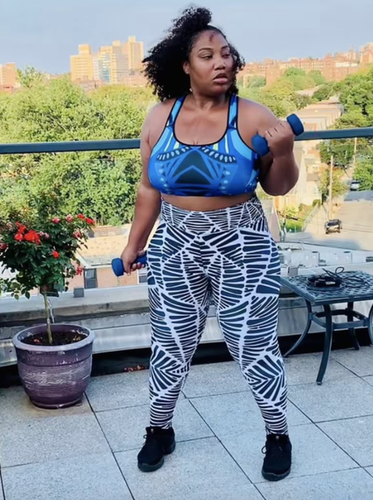 A model showcasing black-and-white printed high-rise leggings