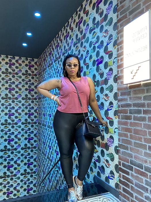 A reviewer posing in the black leggings.