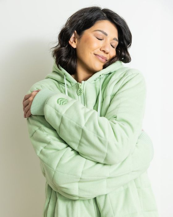 A model showcases the weighted hoodie in action