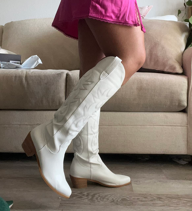 A reviewer styling the boots in white