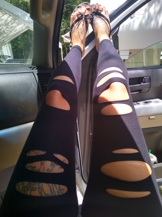 A reviewer's photo highlighting the ripped detailing on the leggings' leg area