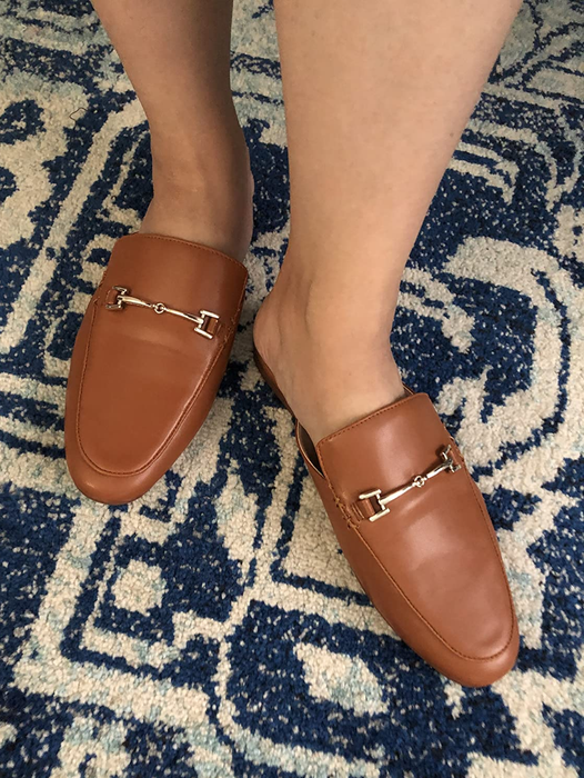 reviewer sporting the brown loafers
