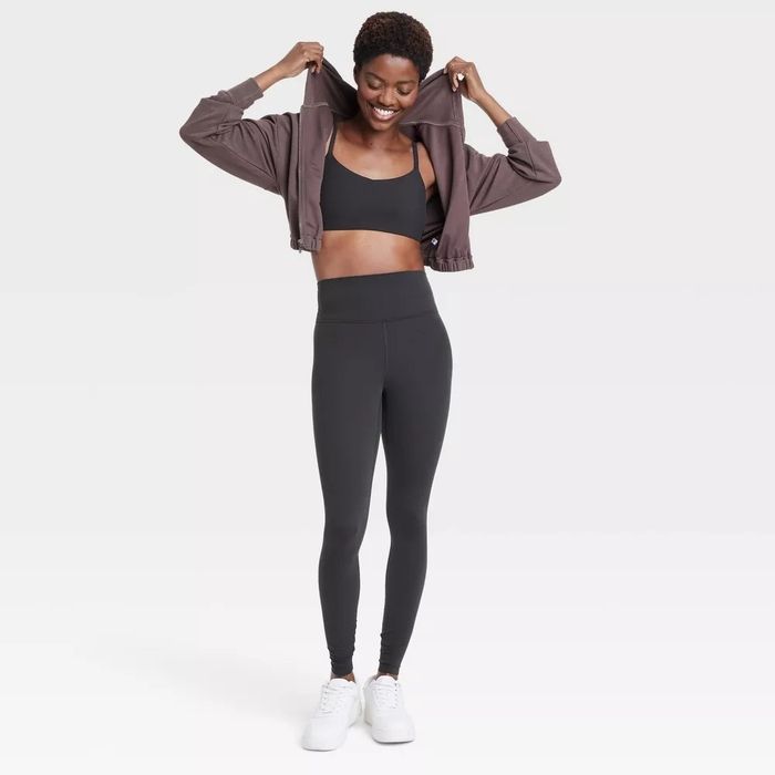 A model wearing high-rise leggings.