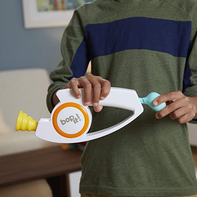 A close-up of the Bop It game, demonstrating the various modes and commands that make it a hit.