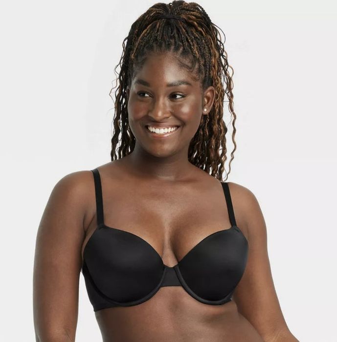 A model showcasing a sleek black push-up bra