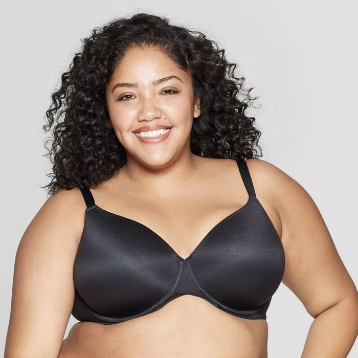 A plus-size model wearing a sleek black bra