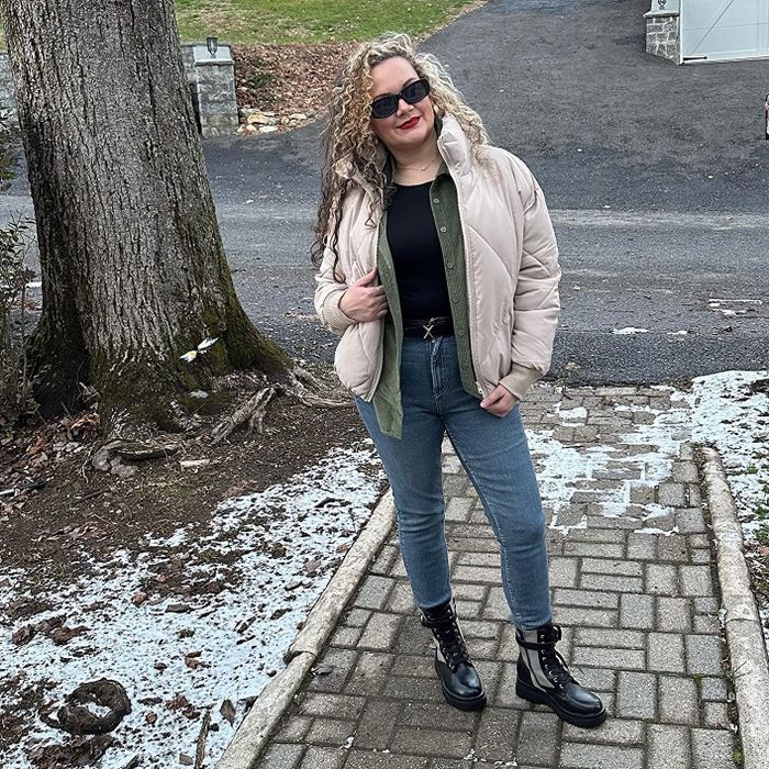 reviewer modeling the waist-length jacket in a light khaki shade