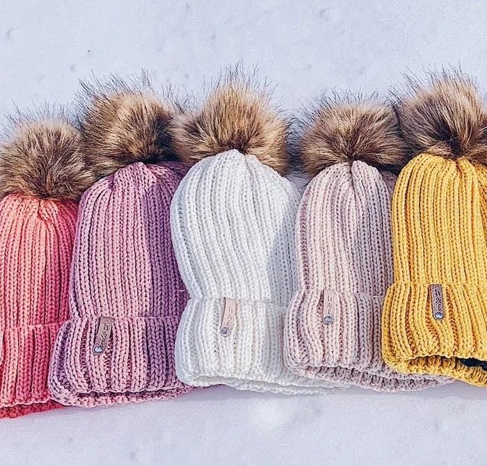 five hats displayed in various colors