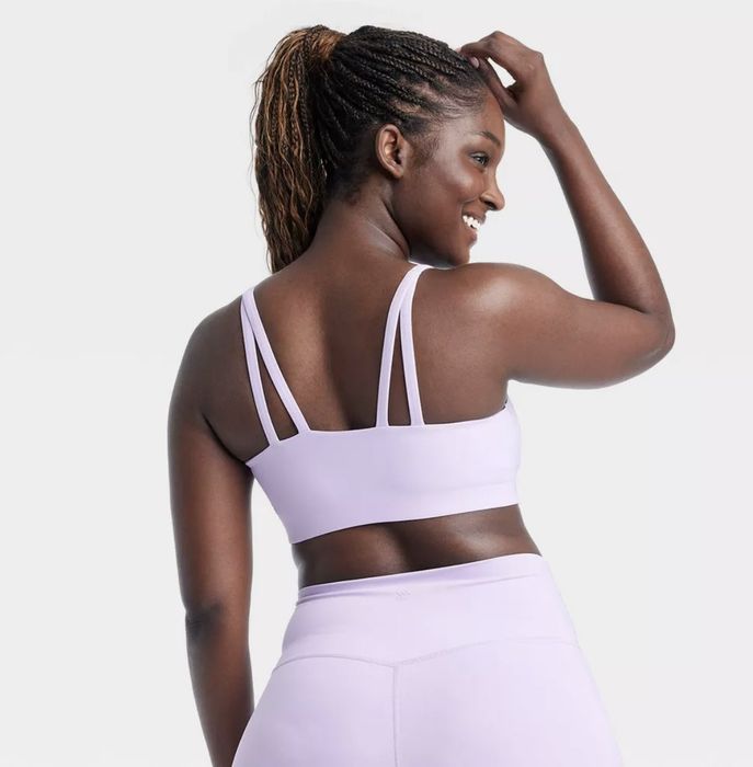 A model showcasing a lavender sports bra from the back