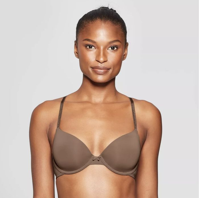 A model wearing a simple, smooth-cupped bra