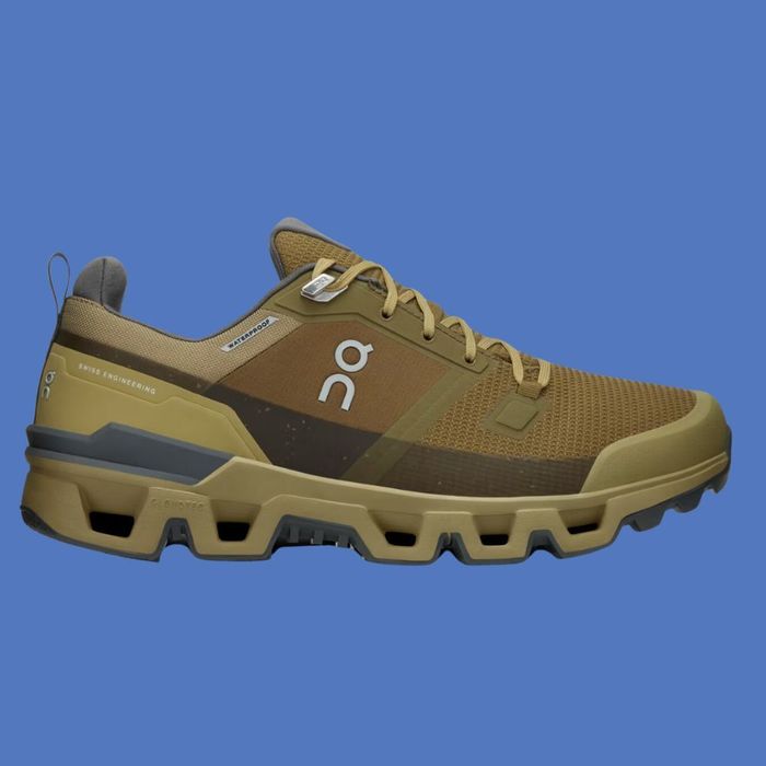 A modern athletic shoe designed for outdoor activities, featuring a durable, supportive sole and breathable mesh material. Perfect for a variety of uses, including shopping.