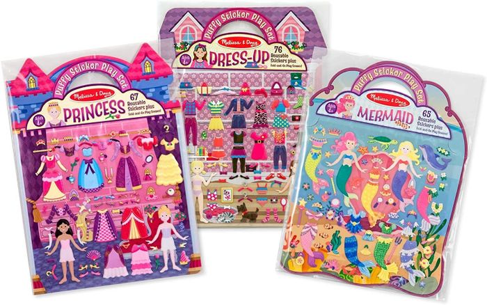 Three books filled with dress-up, princess, and mermaid themed puffy stickers.