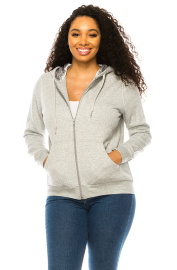 a model wearing the light grey zip-up, showcasing the grey satin interior of the hood