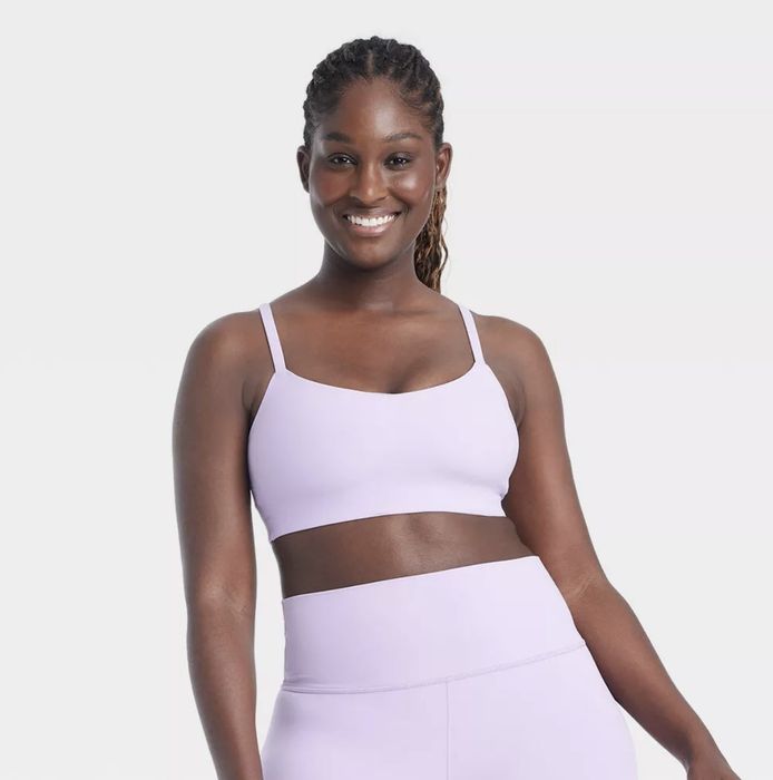 A model wearing a chic lavender sports bra