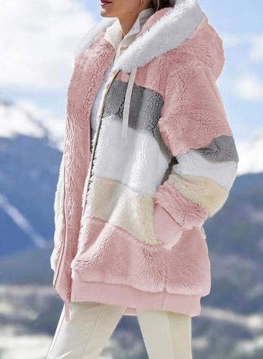 a model showcasing the coat in shades of pink, cream, white, and grey