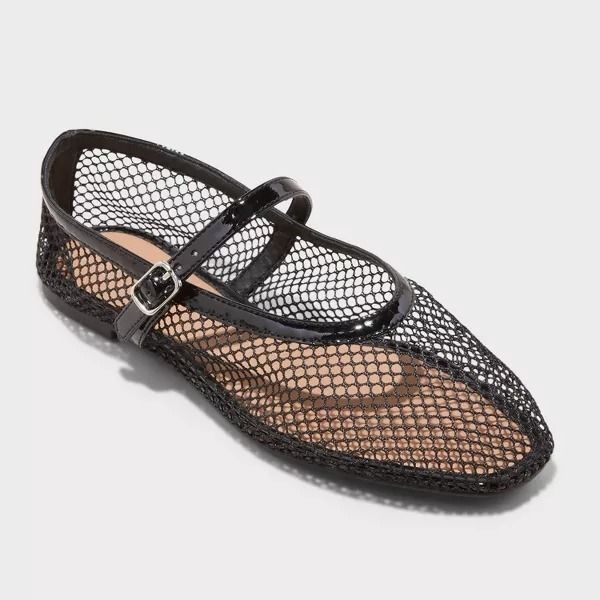 A sleek, black Mary Jane flat shoe with a mesh design, thin straps, and a buckle closure.