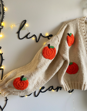 A detailed close-up of one of the cardigan sleeves