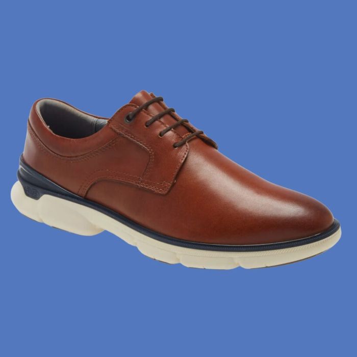 A single brown dress shoe with white athletic soles, perfect for both formal and casual occasions.