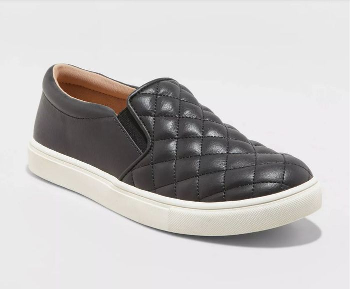 A black quilted leather slip-on sneaker.