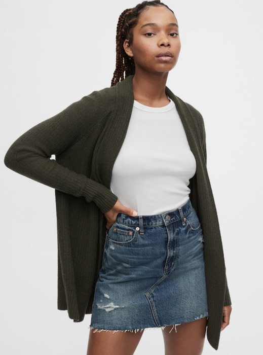 Model wearing an olive green open-front cardigan