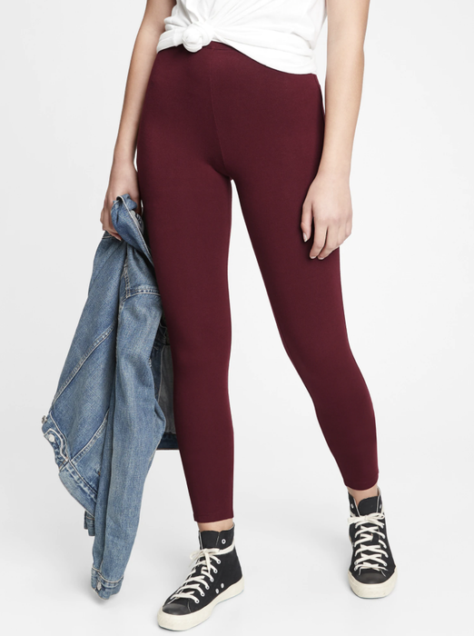 Model showcasing leggings in a vibrant shiraz red