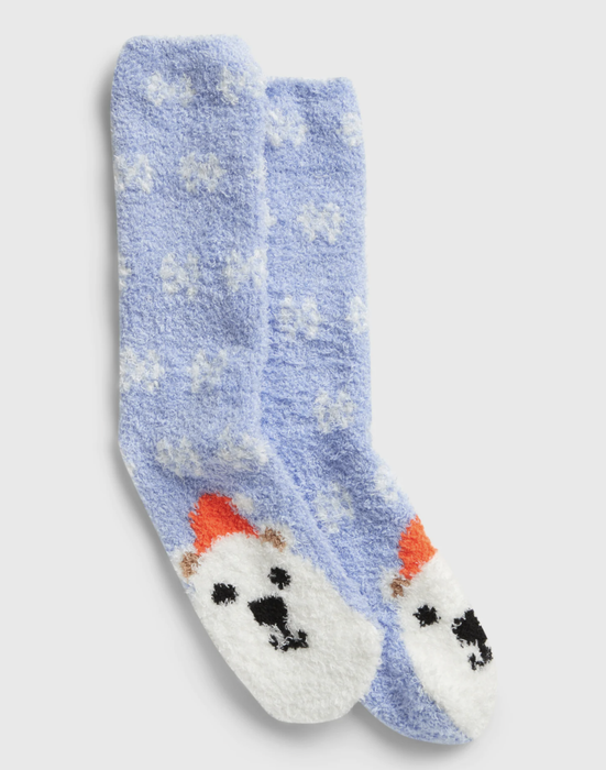 Fuzzy socks adorned with a snowflake and polar bear pattern