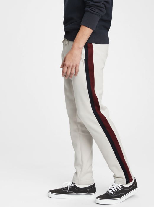 Model wearing sweatpants in a soft powder gray hue