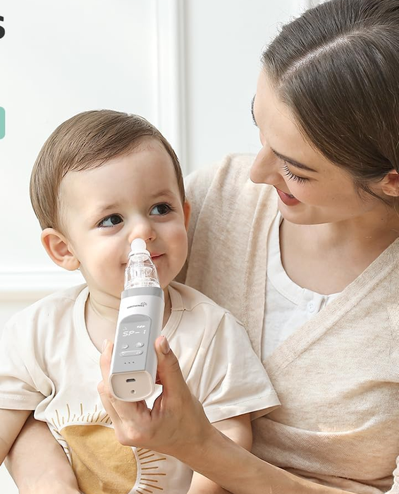 A mother gently using a nasal aspirator on her baby
