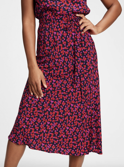 Model showcasing a pink floral midi skirt