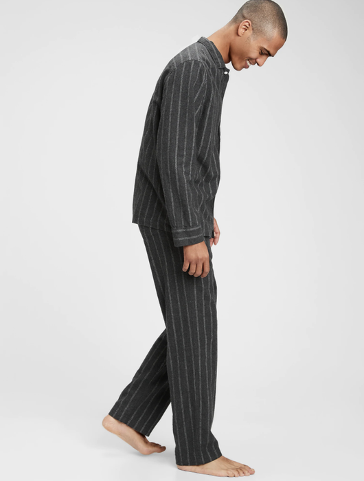 A model showcasing the pinstripe pajama set.
