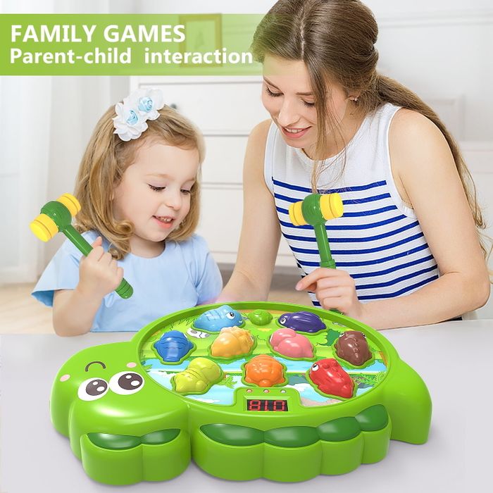 A child and adult are playing a whack-a-mole-style game with colorful frog-shaped targets, using toy hammers. Bold text reads, 