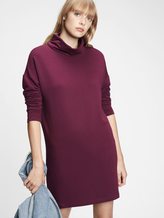 Model wearing a cowlneck dress in the rich secret plum purple shade