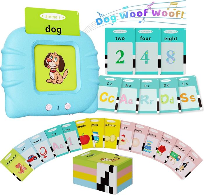 An educational toy with cards displaying words and corresponding images, numbers, and letters. The text on one card reads 