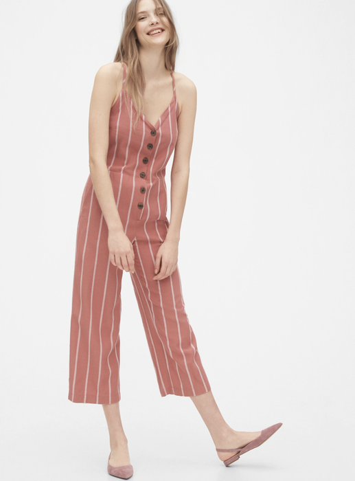 Model showcasing a red stripe tie-back jumpsuit