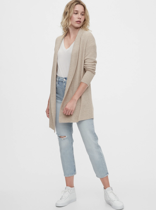 Model showcasing an oatmeal beige open-front cardigan