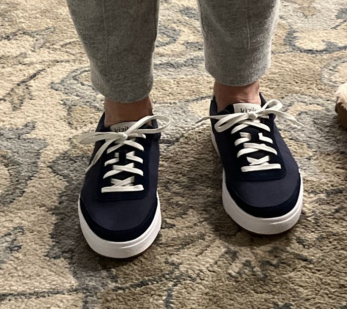 Reviewer showcasing the navy shoes