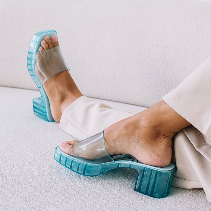 a model showcasing the sandals in blue